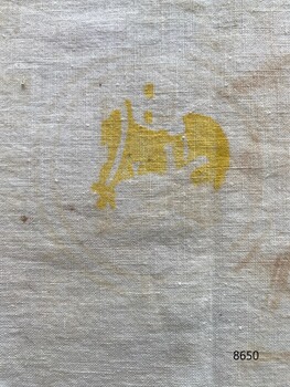 Yellow stamp on back of both bags.