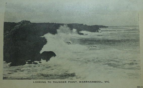 Waves crashing against the cliffs of a rocky shore