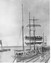 Black and white photograph  of two ships docked at Breakwater and another in the bay. 