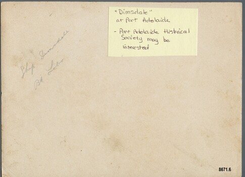 Back of photograph with two handwritten labels naming the ships - one in pencil and one in pen on a paper label