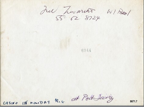 Two different handwritten labels in ink plus a stamped number