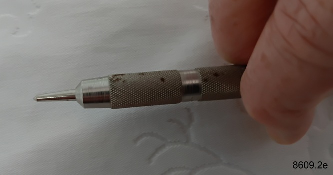 Cigar piercer used to pierce the mouth end of a cigar so it can be smoked.