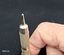 Cigar piercer used to pierce the mouth end of a cigar so it can be smoked.