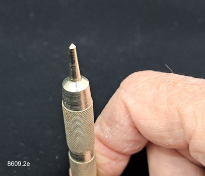 Cigar piercer used to pierce the mouth end of a cigar so it can be smoked.