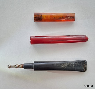 A set of three different accessories for tobacco smokers