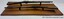 The rifles are each mounted on two pedestals. View is from the bottom towards the top