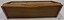 Wooden top is flat and the horizontal piede foined to it has a carved decoration