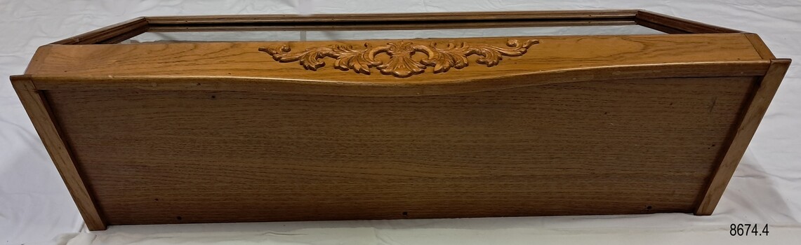 Wooden top is flat and the horizontal piede foined to it has a carved decoration
