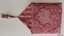 Crimson and cream floral topped cover with triangular flap and tassel
