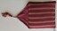 Crimson and cream striped topped cover with triangular flap and tassel