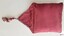 Plain crimson cover with triangular flap and tassel
