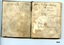 Flyleaf and first page of notebook showing spotting and name and address of owner written in cursive script.