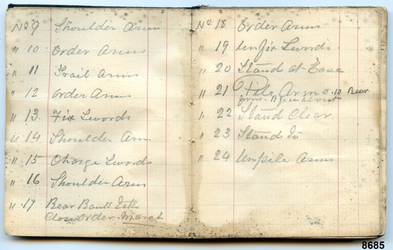 Two pages in pocketbook showing handwritten "presenting arms" parade drill instructions