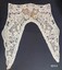 Lace collar with long pointed lapels and rectangular back.
