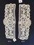 Pair of lace cuffs with flower and ribbon motifs. 