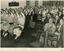 Sepia photograph of nurses and guest seated in rows at an official function