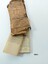 Brown rectangular waterproofed package with folded chart and booklet