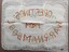 Rectangular tray cloth with crocheted edging and embroidered message.