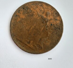 Round metal coin with a weathered figure on the face