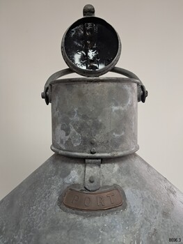 Top of lamp with lid open and handle flat