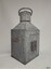 Reverse of lamp, top handle up, side panel with handle, other panel with fitting