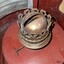 Brass oil burner mounted on its red tank
