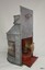 Side profile of lamp with back panel up and burner half out
