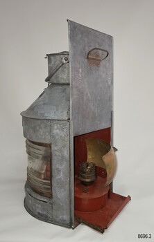 Side profile of lamp with back panel up and burner half out