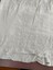 Hem detail on petticoat showing eyelet design and pinspot fabric.