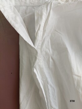 Opening on petticoat with buttons and buttonholes.