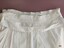 Waistband of overskirt showing hanging loop and grosgrain ribbon band.