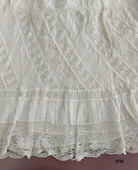 Decorative lace border on petticoat.