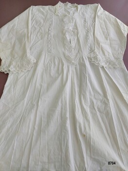 Full length cotton nightgown with broderie anglaise trim on bodice and cuffs.