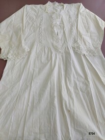 Full length cotton nightgown with broderie anglaise trim on bodice and cuffs.