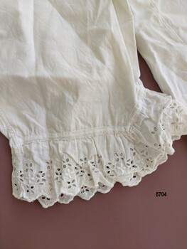 Cuff showing diagonal shape and lace trim.
