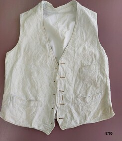 Cream waistcoat with five button holes, five stud holes, a buttonhole for a fob chain and three pockets.
