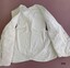 Open waistcoat showing plain cream cotton lining.