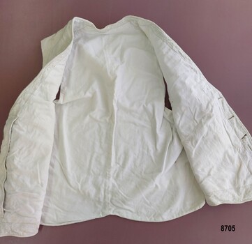 Open waistcoat showing plain cream cotton lining.