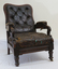 Armchair with timber frame and leather upholstery