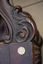 Elaborate carving on the chair's armrest
