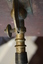 Brass tinting mechanism with screw adjustment