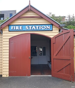Front of timber Fire Station, doors open 