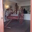Red timber hose cart with fitting for hose nozzle and lamp