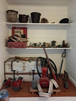 Fire Brigade equipment displayed on shelves and the floor