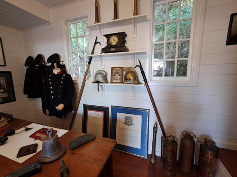 Display includes uniforms, hose nozzles, helmets and certificates