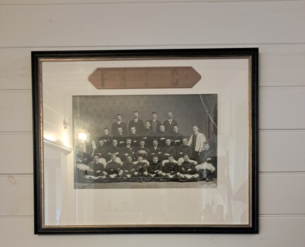 photograph mounted in a black frame, showing WFB Football Club