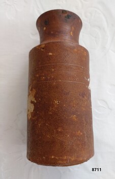 Brown stoneware ink bottle with stright sides and slightly fluted neck
