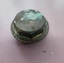 Cylindrical brass fitting with flat, octagonal cap above a 2 cm, round flange.