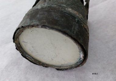 Round metal cylinder with opaque glass in end