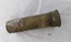 Cylindrical brass tube with slightly flared cap at one end.